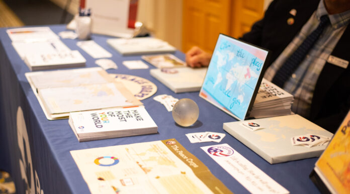 Mercer’s Peace Corps Prep program gives students edge after graduation a table with peace corps flyers on it