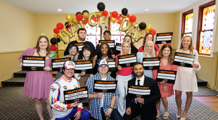 All class of ’24 Mercer medical students match to residency programs on Match Day a group of medical students hold signs saying where they matched