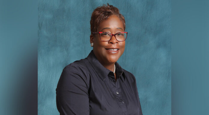 Mercer alumna develops leaders for Atlanta Police Department headshot of stephanie thomas in front of a blue background