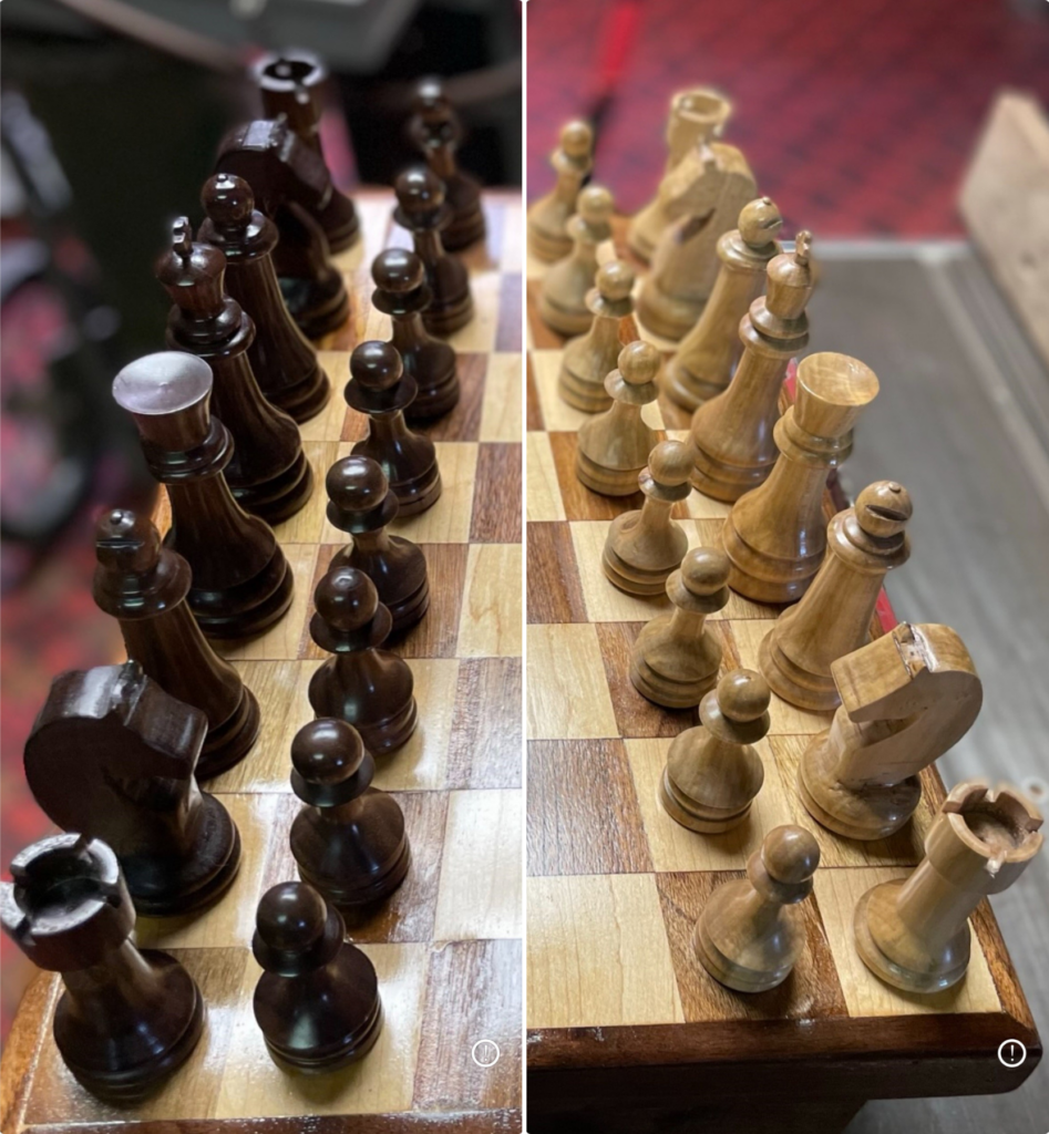 black chess pieces on the left and white chess pieces on the right