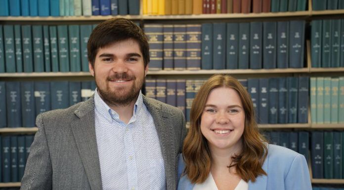 Mercer Law graduate earns 1st runner-up in exclusive national mock trial competition Willie and Tessa Sizemore in the library