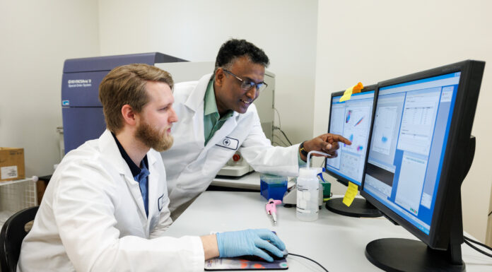 Professor awarded grant to study stem cell therapy for inflammatory bowel disorders Dr. Raghavan Chinnadurai and a biomedical sciences student working in a lab.