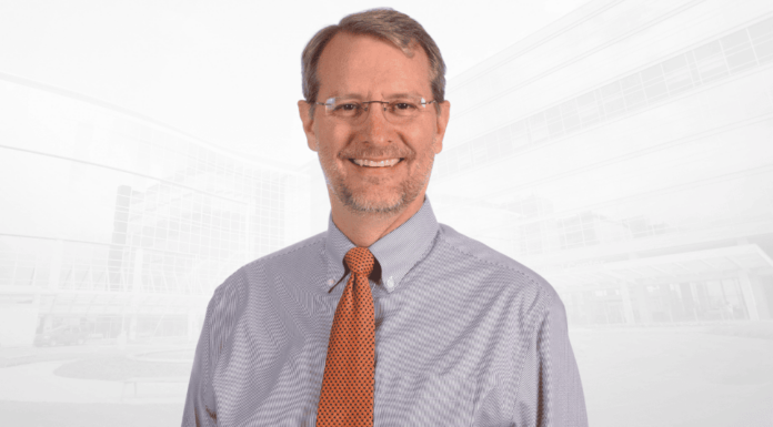 Medical school to host renowned ethicist for inaugural Greenberg-Williams Lectureship Headshot of D. Micah Hester wearing a collared shirt and tie.