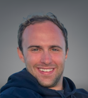 Headshot of Sam Fargo wearing a navy blue hoodie.