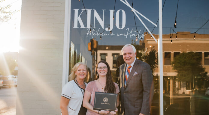 Mercer alumna’s restaurant beats the odds to become integral part of downtown Macon Dr. Penny Elkins, Chelsea Hughes and William D. Underwood standing in front of "Kinjo Kitchen + Cocktails" restaurant, smiling as Chelsea holds her diploma.