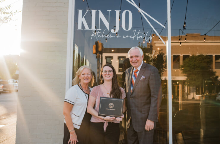 Dr. Penny Elkins, Chelsea Hughes and William D. Underwood standing in front of 