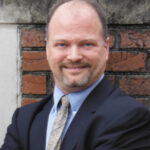 Dr. Douglas E. Thompson