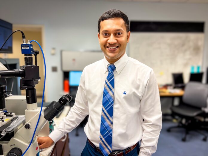 Dr. Raquibul Hasan in the college of pharmacy lab.