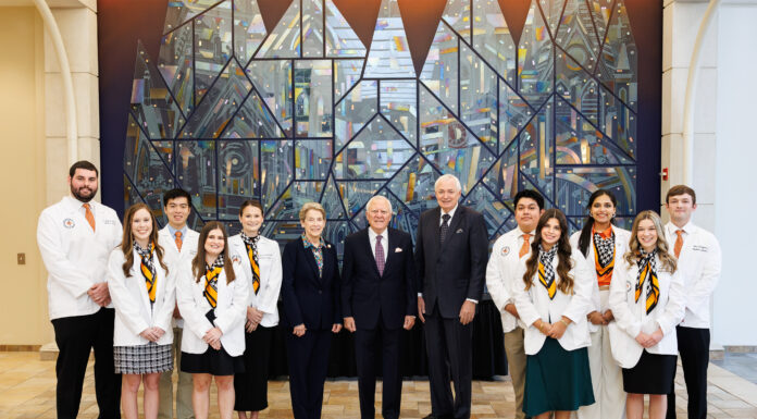 School of Medicine announces 2024 Nathan Deal Scholars 2024 Nathan Deal scholars with Dr. Sumner, Governor Deal, President Underwood in front of glass mural