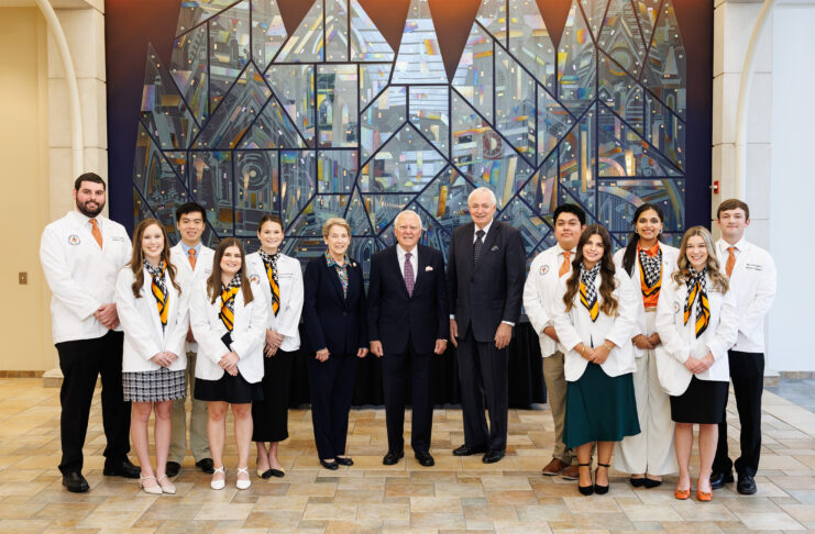 2024 Nathan Deal scholars with Dr. Sumner, Governor Deal, President Underwood in front of glass mural