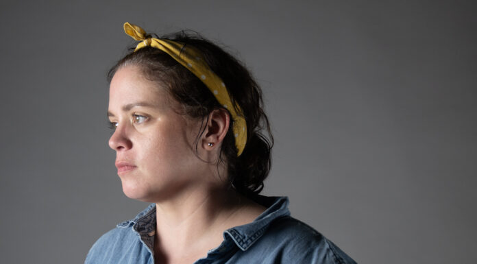 McEachern Art Center presents ‘FOODFACE’ A woman in a yellow bandana and blue shirt looks off towards the left