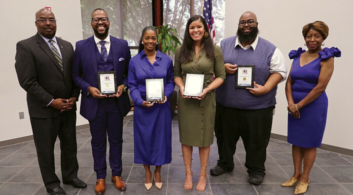 Mercer master’s student among Rural Leader Magazine’s 40 Under 40 Six people stand in a row. The four people in the middle hold plaques.