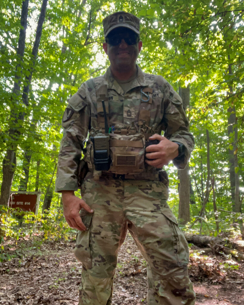 Craig Mattoon stands in a forested area.