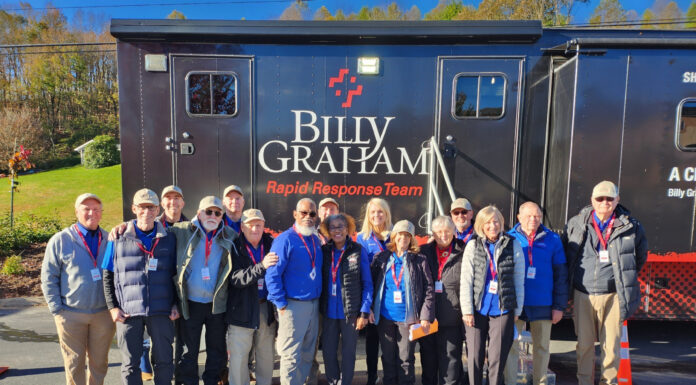 Mercer professor uses his faith to assist in Hurricane Helene efforts Group of people standing together in front of a Billy Graham Rapid Response Team truck.