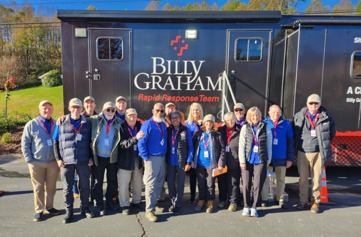 Group of people standing together in front of a Billy Graham Rapid Response Team truck.