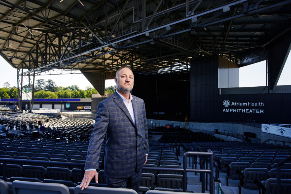 Macon-Bibb County Mayor Lester Miller standing in the Atrium Health Amphitheatre in Macon.