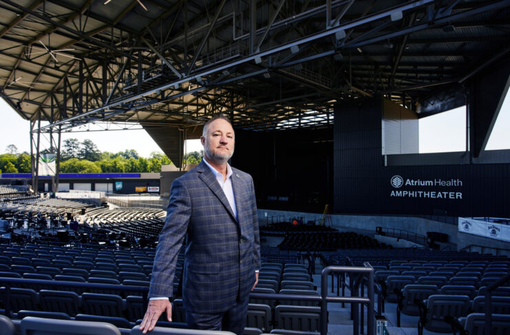 Macon-Bibb County Mayor Lester Miller standing in the Atrium Health Amphitheatre in Macon.