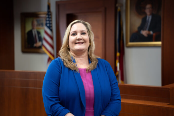 Allison Cartwright stands in a courtroom.
