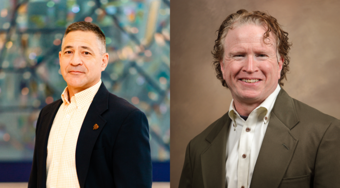 Junod, McCreanor honored on All-Southern Conference Faculty and Staff Team Two men are posed side by side, both wearing suits and button-up shirts, standing against different blurred backgrounds.
