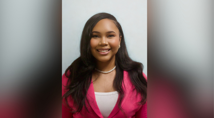 Junior lands coveted Public Policy and International Affairs Fellowship A woman with long dark hair and a pink blazer smiles at the camera in a portrait with a plain background.