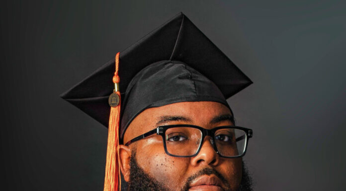 Graduate Spotlight: Samuel Oliver Jr. Samuel Oliver Jr. in graduation gown and cap with an orange tassel and hood.