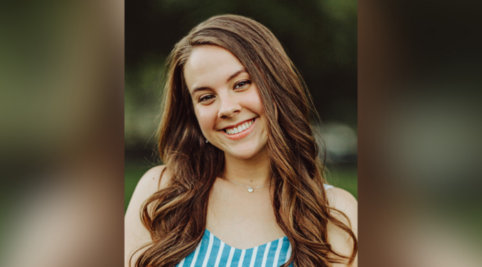 Rising senior Abby Williamson named Snyder Scholar for Excellence in Chemistry A young woman with long brown hair smiles outdoors, wearing a blue and white striped top.
