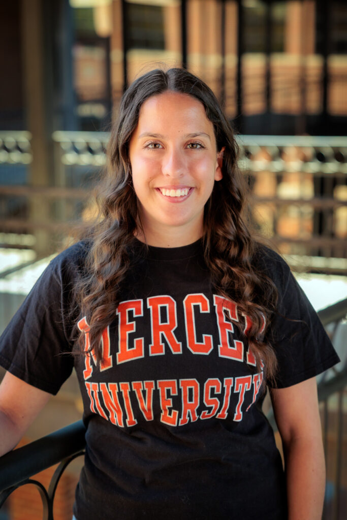 Ainsley Westbrook wears a black Mercer University T-shirt.