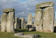 Savor the ordinary as much as the extraordinary because each day is a gift | Dr. Greg DeLoach Large upright stone slabs with horizontal stones on top, forming part of the Stonehenge monument under a partly cloudy sky.