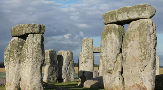 Savor the ordinary as much as the extraordinary because each day is a gift | Dr. Greg DeLoach Large upright stone slabs with horizontal stones on top, forming part of the Stonehenge monument under a partly cloudy sky.