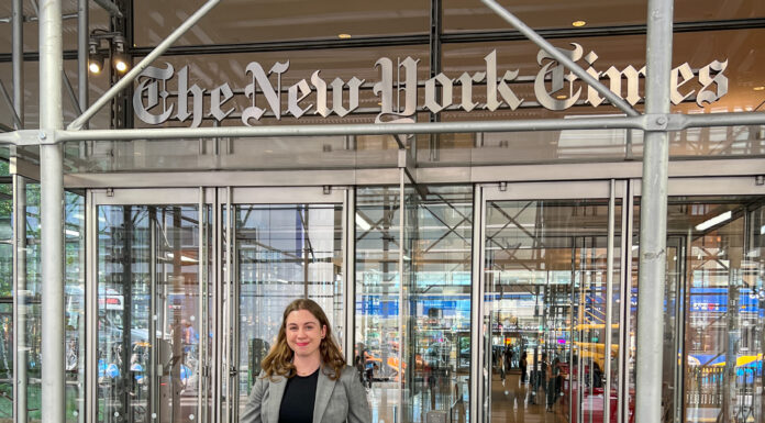 Mercer alumna covers breaking news as part of New York Times fellowship Rylee Kirk stands in front of The New York Times building entrance.