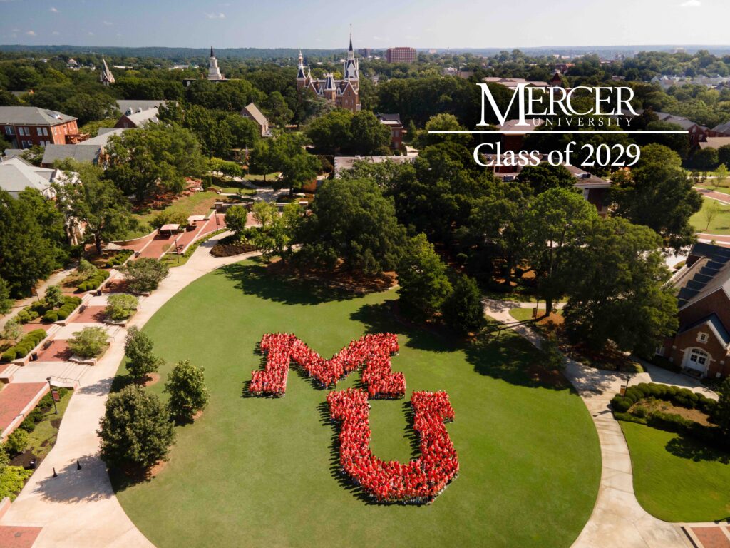 Aerial view of students in red shirts forming MU on a campus lawn, labeled Mercer University Class of 2029.