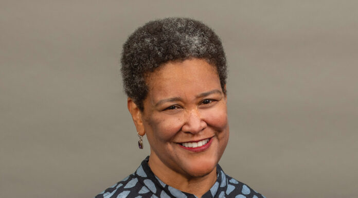 Lamar Lecture Series to feature historian and scholar of African American studies Dr. Leslie Harris A woman with short curly hair and patterned shirt smiles in front of a plain, neutral background.