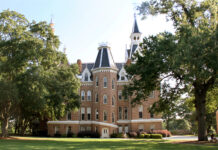 President Dr. Penny L. Elkins announces two cabinet appointments A historic, three-story brick building with steep towers and white trim sits surrounded by large trees and green lawn.