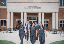 Mercer and Presbyterian College launch dual-degree nursing pathway Five nursing students walk and talk outside the Georgia Baptist College of Nursing building.