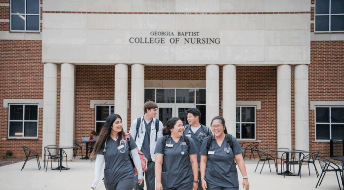 Mercer and Presbyterian College launch dual-degree nursing pathway Five nursing students walk and talk outside the Georgia Baptist College of Nursing building.