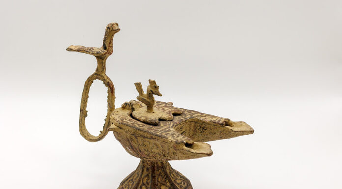 Mercer’s Tarver Library to open exhibit of ancient oil lamps An ornate, ancient bronze oil lamp with animal-shaped decorations on a plain white background.