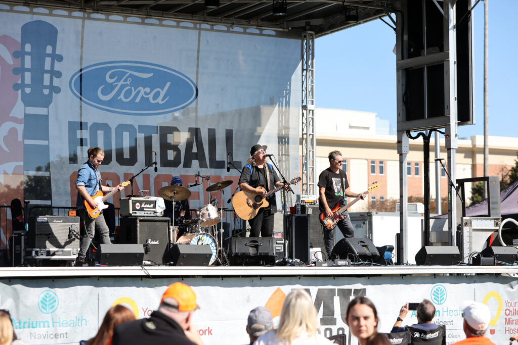 Drivin N Cryin performs on an outdoor stage on Black Field.
