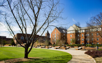 Faculty and Staff Notables | December 2025 A tree in front of a building.
