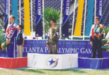 A Paralympic champion, Mercer alumnus uses law degree for disability advocacy Three male athletes stand on a Paralympic podium with medals and flowers at the Atlanta Paralympic Games.