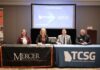 Mercer and Technical College System of Georgia sign transfer agreements to expand bachelor’s degree pathways Four people sit at tables with Mercer University and TCSG logos, signing an articulation agreement in a conference room.