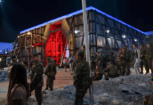 Mercer music professor plays soldier in Stranger Things Stranger Things set featuring soldiers and Dr. Christopher Schmitz in the lower right corner.