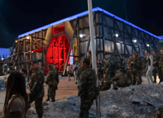 Mercer music professor plays soldier in Stranger Things Stranger Things set featuring soldiers and Dr. Christopher Schmitz in the lower right corner.