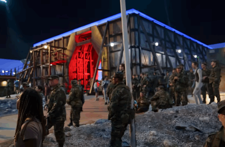 Stranger Things set featuring soldiers and Dr. Christopher Schmitz in the lower right corner.