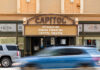 Mercer acquires downtown Macon’s historic Capitol Theatre Capitol Theatre marquee reads Introducing Robins Financial Capitol Theatre with cars passing by in front.