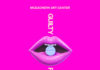 McEachern Art Center presents ‘Guilty Pleasures’ Bright pink poster with glossy lips holding a blue pill, promoting Guilty Pleasures art exhibit by Brittany Coburn.