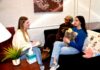 Mercer’s Macon campus launches peer counseling program Three women sit in a cozy room talking; one takes notes, while another holds a stuffed animal on the couch.