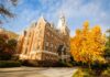 Mercer again named a top beautiful college campus by U.S. News & World Report Historic brick building with pointed towers surrounded by autumn trees under a partly cloudy sky.