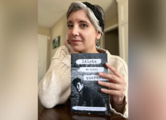 Discovery of dad’s love letters leads Spanish professor to compile them in book Dr. Clara Mengolini holds a book titled Idiota de tanto quererte and looks at the camera.