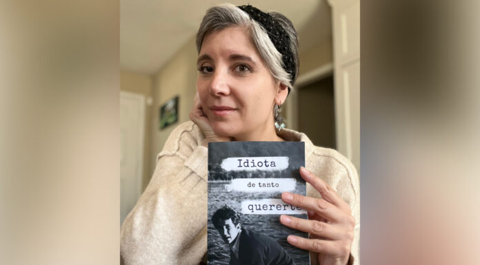 Discovery of dad’s love letters leads Spanish professor to compile them in book Dr. Clara Mengolini holds a book titled Idiota de tanto quererte and looks at the camera.