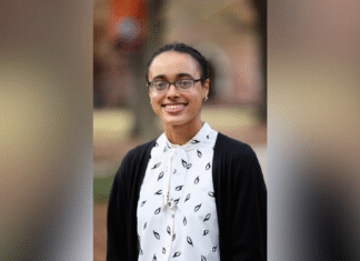 Senior named Georgia Society of Professional Engineers Student of the Year A woman wearing glasses, a white blouse with a black pattern, and a black cardigan stands outdoors, smiling.